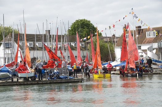 Mirror dinghies rigging and preparing to go afloat at Itchenor SC with the tide in