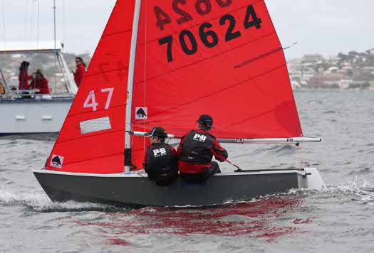 Grey GRP Mirror dinghy number 70624 crossing a finishing line