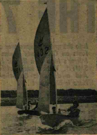 Two Mirror dinghes sailing on a river