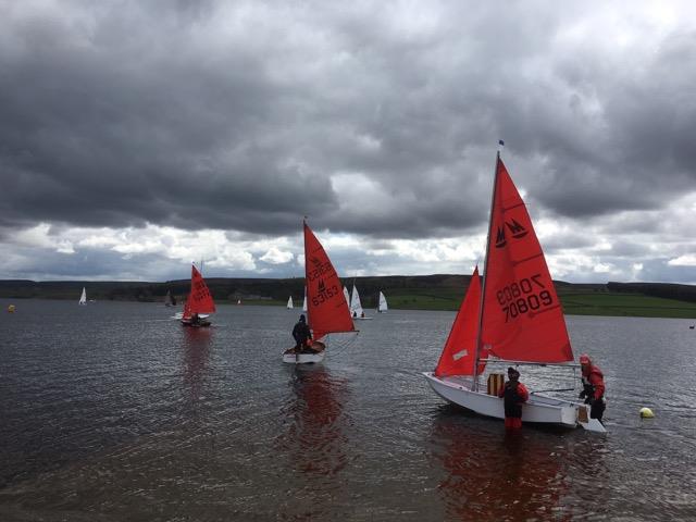 Mirror dinghies launching to race on a cloudy day