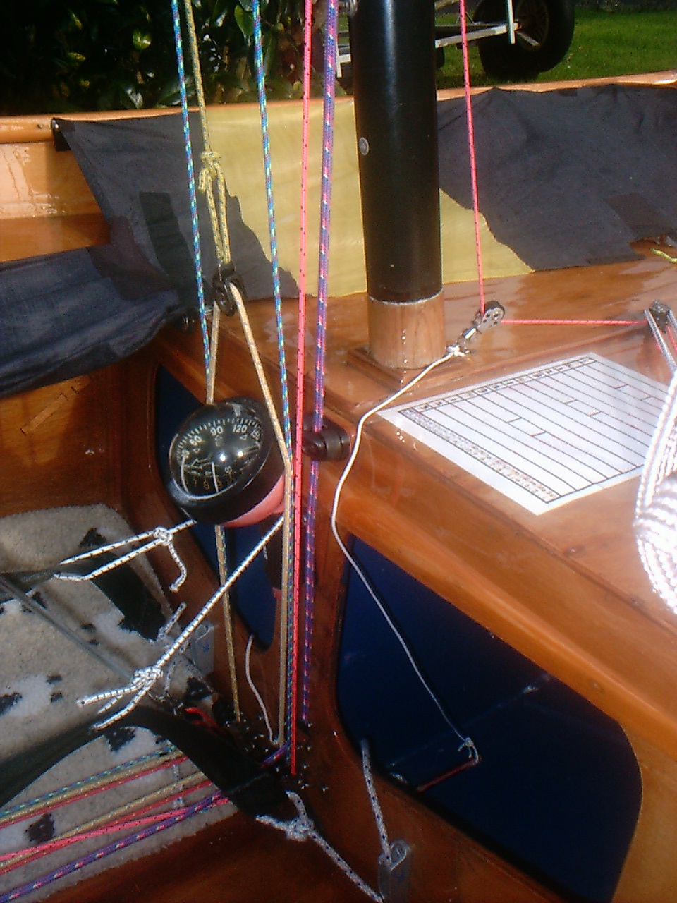 Cleat for spinnaker pole deployment line on stowage bulkhead